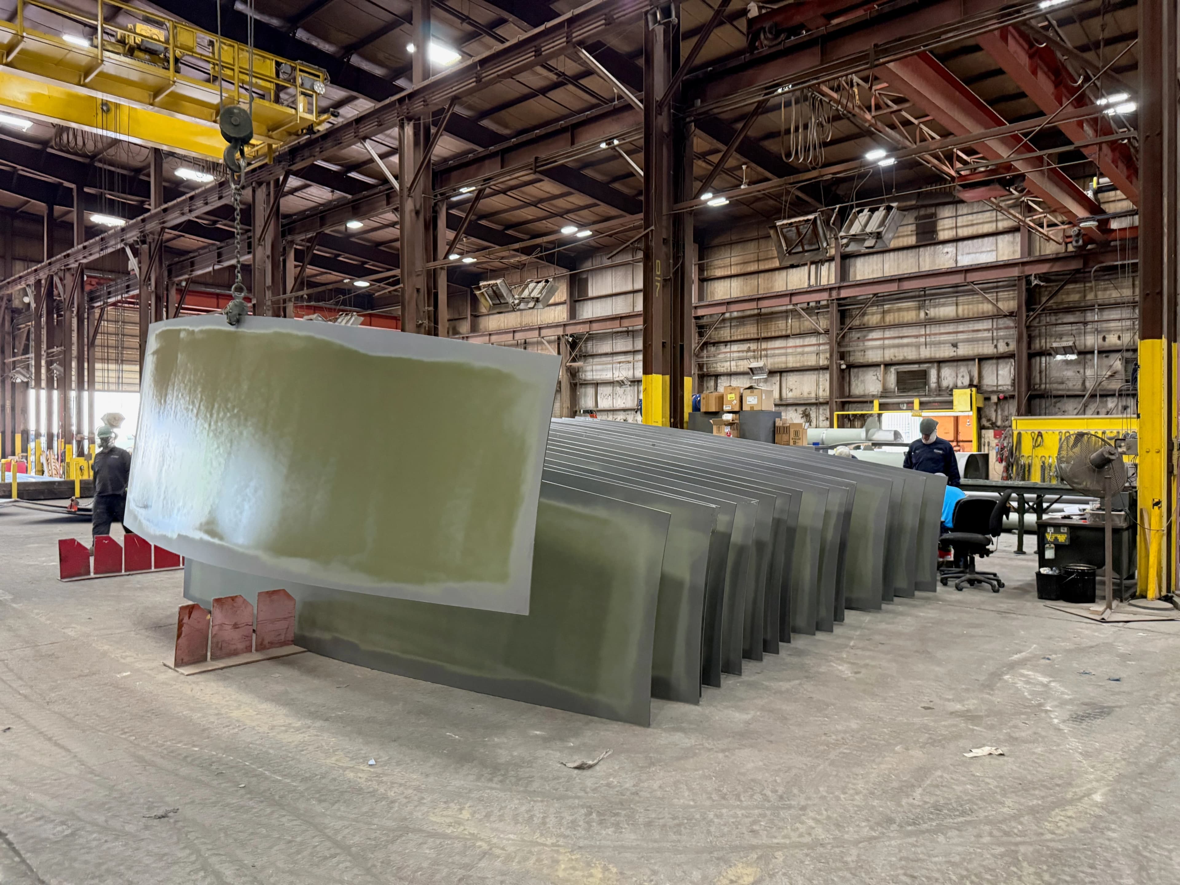 Curved panels and overhead cranes on a client's shop floor